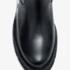 Low Boots in Black Oleatex